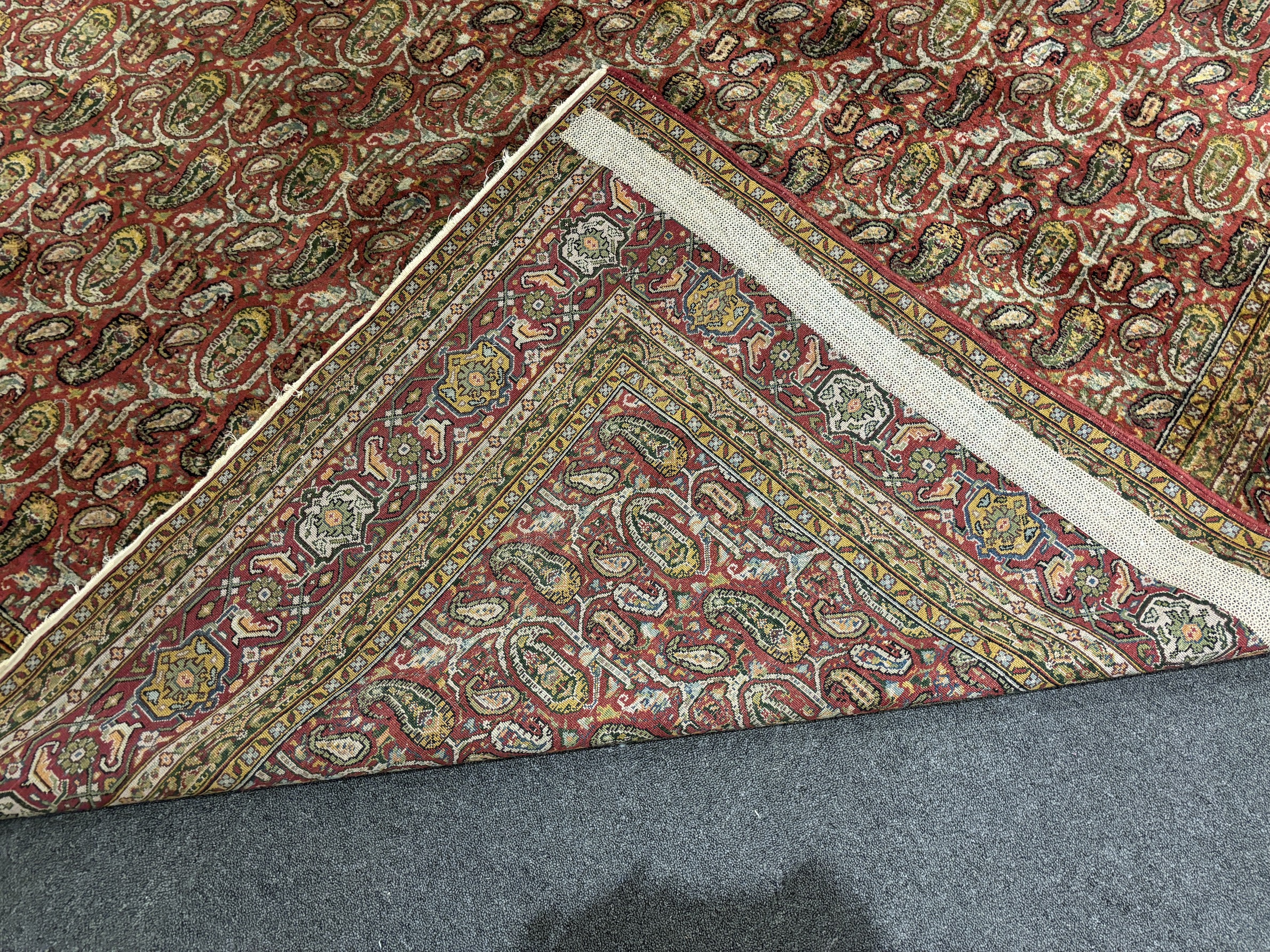 A Khorasan red ground carpet, approximately 12ft. X 9ft. (damage to one small area neatly repaired)